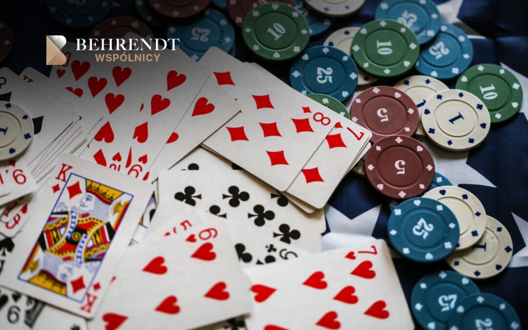 Logo of BEHRENT? WSPÓLNICY overlaid on a spread of playing cards and poker chips, suggesting gaming or risk themes
